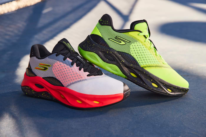 White and yellow Skechers basketball shoes on an outdoor court.